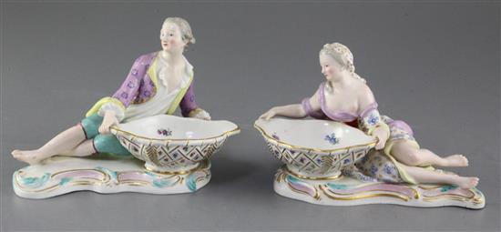 A pair of Meissen figural salts, late 19th century, length 17cm, tiny chips